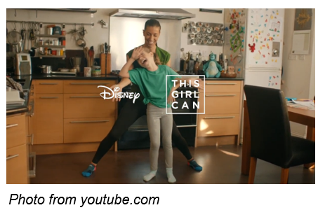 photo from youtube.com mother and daughter dancing in kitchen to “I Wanna Be Like You” from The Jungle Book | This Girl Can, with Sofia and Cat