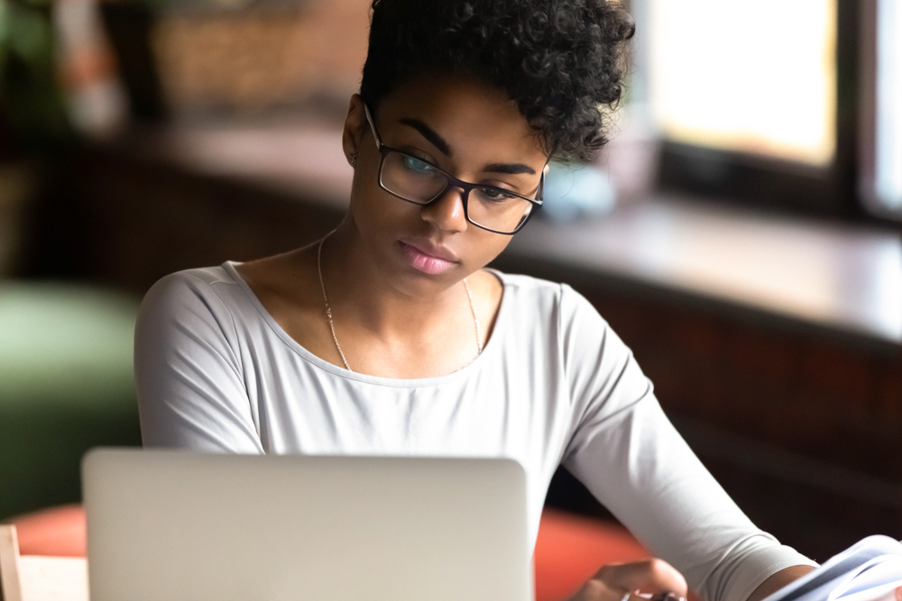 Woman looking at computer intently