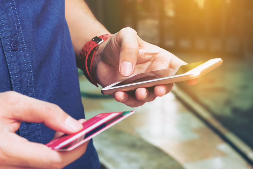 Shutterstock_540545581 Man use smart phone and holding credit card with shopping online. Online payment concept.