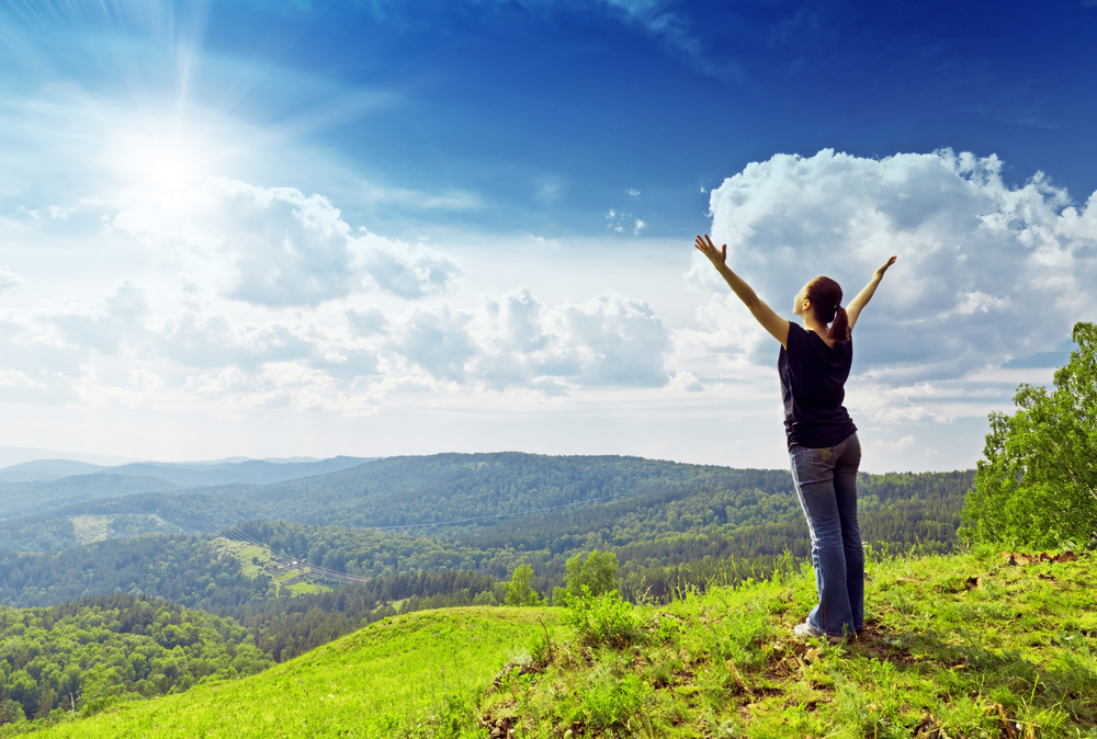 Shutterstock_95278852  Young woman enjoying the fresh air.