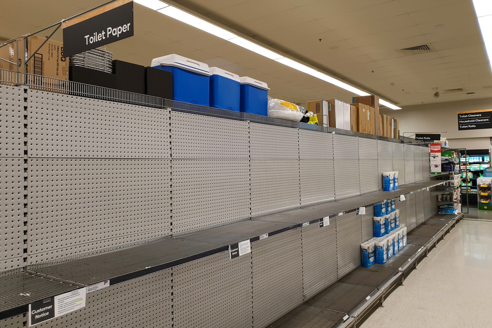 Shutterstock_1666793398  Gold Coast, Australia - March 8, 2020: Coles supermarket empty toilet paper shelves amid coronavirus fears, shoppers panic buying and stockpiling toilet paper as Australia prepares for a pandemic.