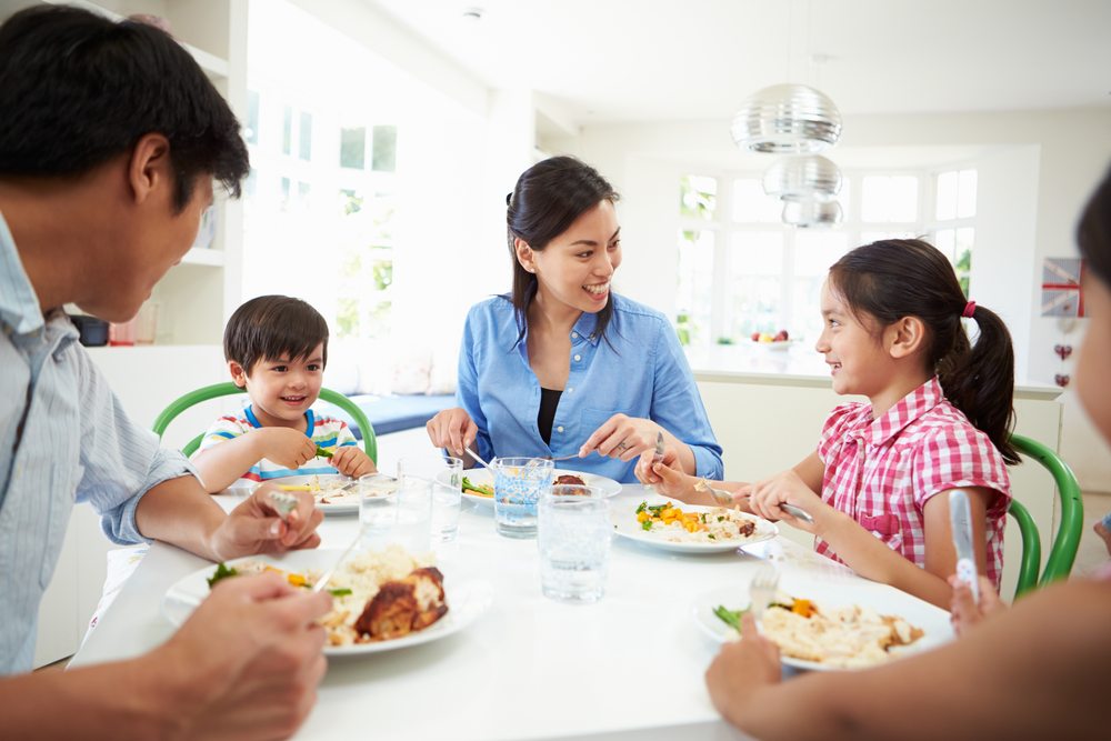 Shutterstock_177030098 Asian Family Sitting At Table Eating Meal Together