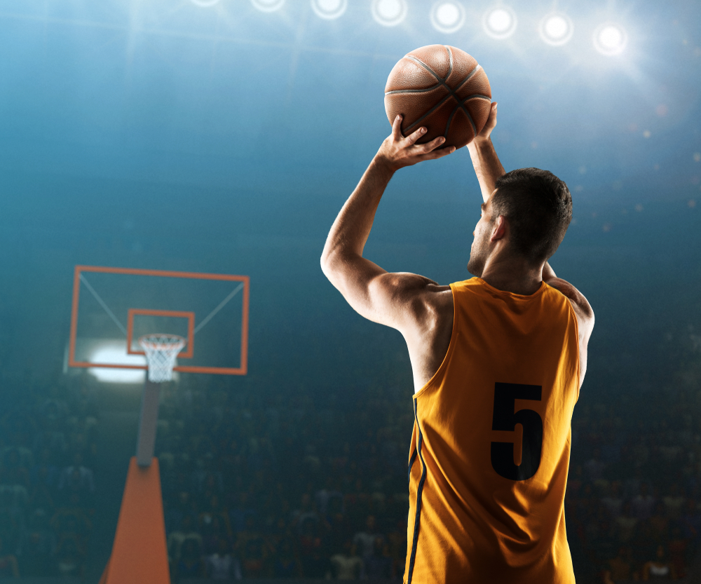 Shutterstock_1293705412  Professional basketball player shoots a three point shot