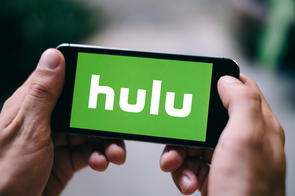 Shutterstock_1034739478 COLOGNE, GERMANY - FEBRUARY 27, 2018: Closeup of Hulu logo displayed on Apple iPhone