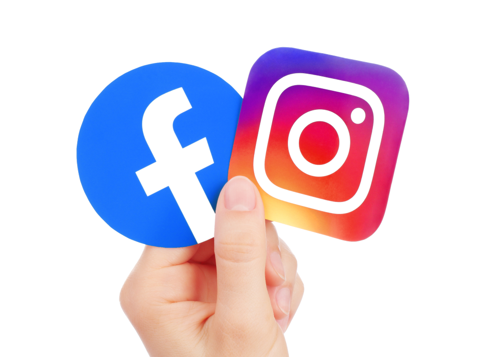 Shutterstock_1428088466 Kiev, Ukraine - May 15, 2019: Hand holds new Facebook logo and Instagram printed on paper. Instagram is a photo and video-sharing social networking service owned by Facebook.