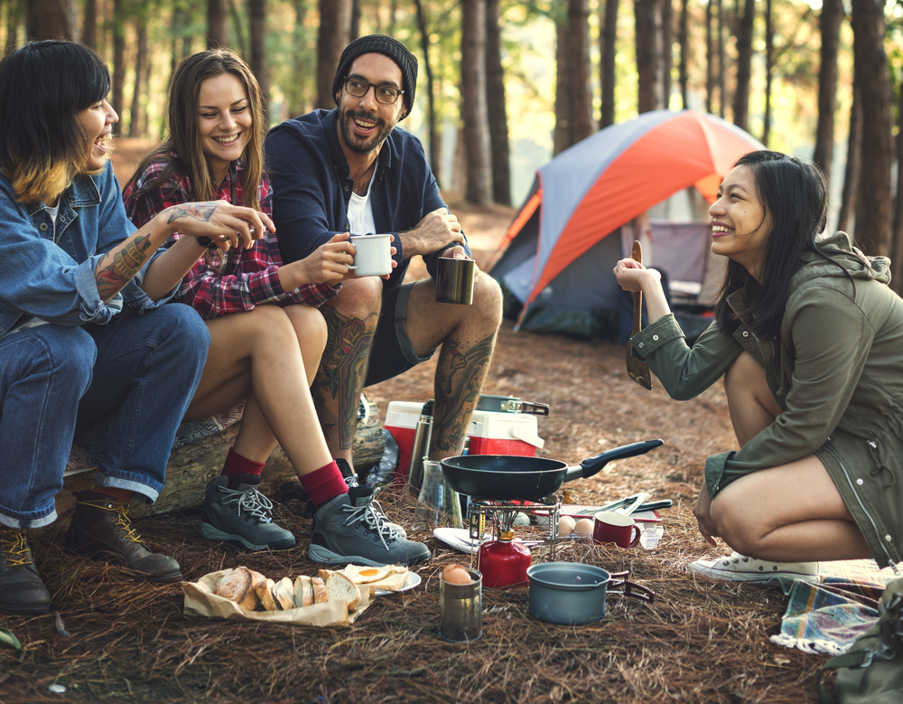 Shutterstock_520119067 Friends Camping Eating Food Concept