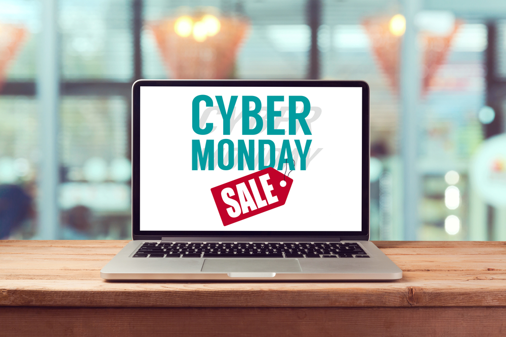 Shutterstock_332590928 Cyber Monday sign on laptop computer. Holiday online shopping concept. View from above