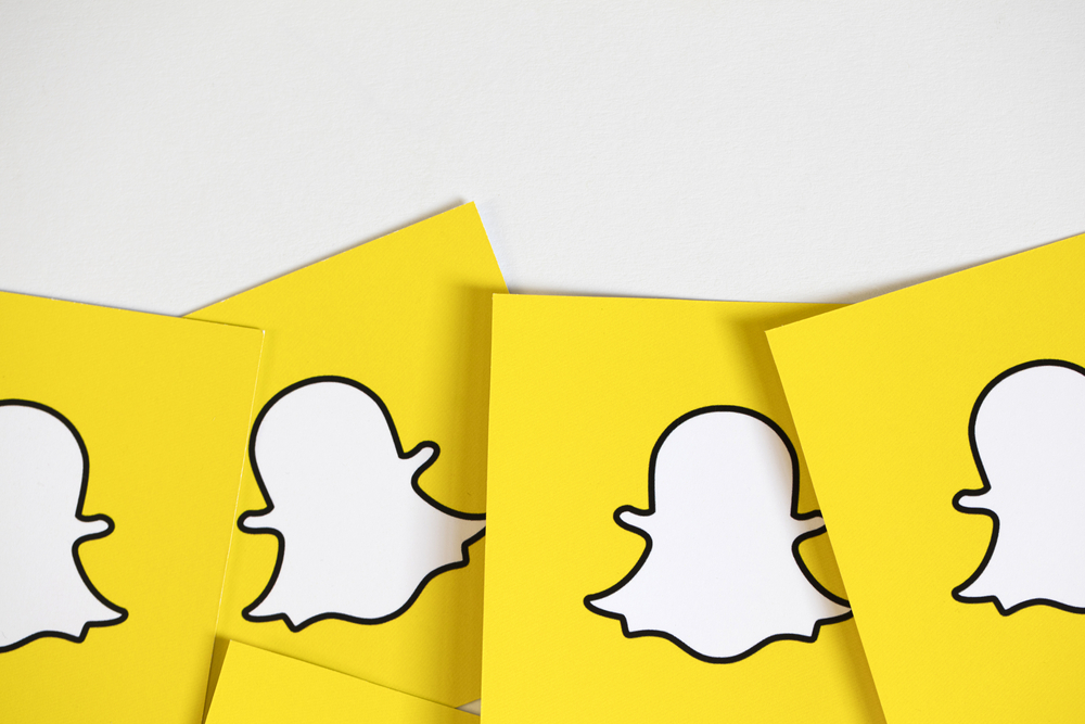 Shutterstock_529584769 OXFORD, UK - DECEMBER 5th 2016: Snapchat logos printed onto paper. Snapchat is a popular social media application for sharing messages, images and videos